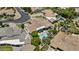 Aerial shot of a private backyard with a sparkling blue pool, patio and desert landscape at 11439 E Bella Vista St, Scottsdale, AZ 85259