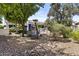 Beautiful backyard featuring a swimming pool, lush greenery, trees and desert landscaping at 11439 E Bella Vista St, Scottsdale, AZ 85259