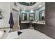 Modern bathroom with dual vanities, a soaking tub, and a walk-in shower at 11439 E Bella Vista St, Scottsdale, AZ 85259