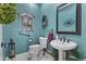 Charming powder room with unique blue walls and decorative sink at 11439 E Bella Vista St, Scottsdale, AZ 85259