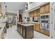 Large kitchen island with breakfast bar and stainless steel appliances, offering plenty of workspace at 11439 E Bella Vista St, Scottsdale, AZ 85259