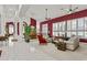 Expansive living room featuring bright light, comfortable seating, and open layout to the dining area at 11439 E Bella Vista St, Scottsdale, AZ 85259