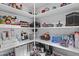Well-organized pantry with shelving, providing ample storage for food and household items at 11439 E Bella Vista St, Scottsdale, AZ 85259