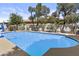 Clear in-ground swimming pool with desert landscaping, surrounded by a safety fence at 11439 E Bella Vista St, Scottsdale, AZ 85259
