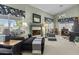 Sitting area with a fireplace, a chaise lounge, and a large window at 11439 E Bella Vista St, Scottsdale, AZ 85259