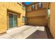 A bright and sunny backyard with a sliding door, attached garage, and neutral color scheme at 11959 W Pierce St, Avondale, AZ 85323