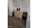 Bedroom featuring a sideboard table with neutral carpeting and two windows at 11959 W Pierce St, Avondale, AZ 85323