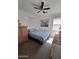 Bedroom featuring a neutral toned color scheme, a ceiling fan, and two windows for natural light at 11959 W Pierce St, Avondale, AZ 85323