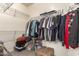 Walk-in closet offers metal shelving and storage space, perfect for organizing your wardrobe at 11959 W Pierce St, Avondale, AZ 85323