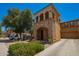 Stunning two-story house with a stone facade, private balcony, and well-maintained desert landscaping at 11959 W Pierce St, Avondale, AZ 85323