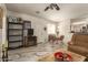 Open concept living room featuring tile floors, a television, and a dining area at 11959 W Pierce St, Avondale, AZ 85323