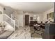 A bright living room with marble floors, staircase, leather sofas, and stylish coffee table at 11959 W Pierce St, Avondale, AZ 85323