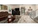 Open living room with marble floors, a large window, and comfortable seating area at 11959 W Pierce St, Avondale, AZ 85323