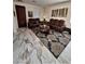 Inviting living room features tile floors, comfortable seating, and natural light at 11959 W Pierce St, Avondale, AZ 85323