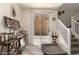 Cozy living area featuring marble floors, staircase, sliding glass doors and stylish décor at 11959 W Pierce St, Avondale, AZ 85323
