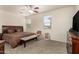 Spacious main bedroom with carpet, ceiling fan, and natural light at 11959 W Pierce St, Avondale, AZ 85323