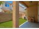 Covered patio with artificial turf and a view of the backyard at 11959 W Pierce St, Avondale, AZ 85323