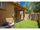 Backyard showing patio with covered overhang and landscaped lawn at 11959 W Pierce St, Avondale, AZ 85323