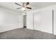Bright bedroom featuring neutral walls, ceiling fan, closet and gray carpet flooring at 1234 N 84Th Pl, Scottsdale, AZ 85257