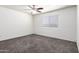 Bright bedroom with neutral carpet, a large window, and fresh paint, providing a blank canvas for personalization and relaxation at 1234 N 84Th Pl, Scottsdale, AZ 85257