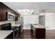 Updated kitchen boasting stainless steel appliances, white countertops, dark cabinetry, and a bright, open design, perfect for modern living at 1234 N 84Th Pl, Scottsdale, AZ 85257
