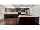 Modern kitchen featuring stainless steel appliances, white countertops, dark cabinets, and stylish backsplash, perfect for cooking at 1234 N 84Th Pl, Scottsdale, AZ 85257