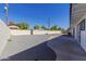 Backyard space featuring gravel, a concrete patio, and a block fence at 126 E Northern Ave, Phoenix, AZ 85020