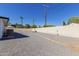 Spacious backyard features gravel landscaping with mature trees and block fencing at 126 E Northern Ave, Phoenix, AZ 85020