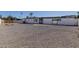 Large backyard with gravel landscaping and a single-story home, offering privacy at 126 E Northern Ave, Phoenix, AZ 85020