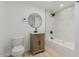 Updated bathroom featuring vanity, toilet, and marble style tile and modern fixtures at 126 E Northern Ave, Phoenix, AZ 85020