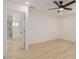Light-filled bedroom with an attached ensuite bathroom and modern ceiling fan at 126 E Northern Ave, Phoenix, AZ 85020