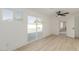 Bedroom with a ceiling fan, sliding glass doors, and wide-plank flooring at 126 E Northern Ave, Phoenix, AZ 85020