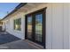Close up of the black frame double doors leading to the exterior from the home at 126 E Northern Ave, Phoenix, AZ 85020