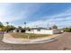 Charming corner-lot home with modern black and white exterior paint scheme and mature palm trees at 126 E Northern Ave, Phoenix, AZ 85020