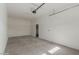 Spacious two car garage with white walls, concrete floor and automatic door opener at 126 E Northern Ave, Phoenix, AZ 85020