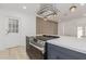 Remodeled kitchen with island cooktop, designer hood and breakfast bar at 126 E Northern Ave, Phoenix, AZ 85020