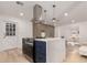 Updated kitchen featuring a center island with modern range and white quartz countertops, stylish pendant lights at 126 E Northern Ave, Phoenix, AZ 85020
