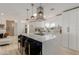 Bright kitchen boasts a large island with seating, modern appliances, and stylish pendant lighting at 126 E Northern Ave, Phoenix, AZ 85020