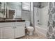 Well-lit bathroom with shower-tub combination, toilet, and granite vanity at 134 W Campbell Ct, Gilbert, AZ 85233