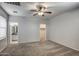 Spacious bedroom features neutral carpeting, ceiling fan, and ensuite bathroom and closet access at 134 W Campbell Ct, Gilbert, AZ 85233