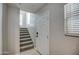 Bright entryway with a staircase leading to the upper level and tile flooring at 134 W Campbell Ct, Gilbert, AZ 85233