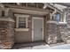 A welcoming front door with stone pillars and address number 134 at 134 W Campbell Ct, Gilbert, AZ 85233