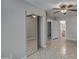 Main bedroom featuring tile floors, a ceiling fan, and mirrored closet doors at 134 W Campbell Ct, Gilbert, AZ 85233