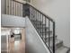 Carpeted staircase with black metal railings, leading to the upper level of the home at 134 W Campbell Ct, Gilbert, AZ 85233