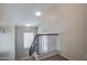 View of a carpeted staircase with iron railing and a window at the top landing at 134 W Campbell Ct, Gilbert, AZ 85233