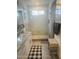 A bathroom features granite countertops, tile flooring, a glass-enclosed shower, and natural light at 13819 E Cavalry Dr, Scottsdale, AZ 85262