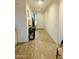 Bright hallway featuring wood-look tile flooring and ample natural light at 13819 E Cavalry Dr, Scottsdale, AZ 85262