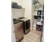 A laundry room provides ample storage and organization, as well as modern washer and dryer at 13819 E Cavalry Dr, Scottsdale, AZ 85262