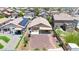 Aerial view of the private backyard featuring a gravel space with a paved patio, perfect for outdoor entertaining at 1384 S 222Nd Ln, Buckeye, AZ 85326