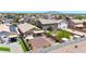 A full backyard aerial view showcases the landscaping design, privacy fence, and covered patio at 1384 S 222Nd Ln, Buckeye, AZ 85326